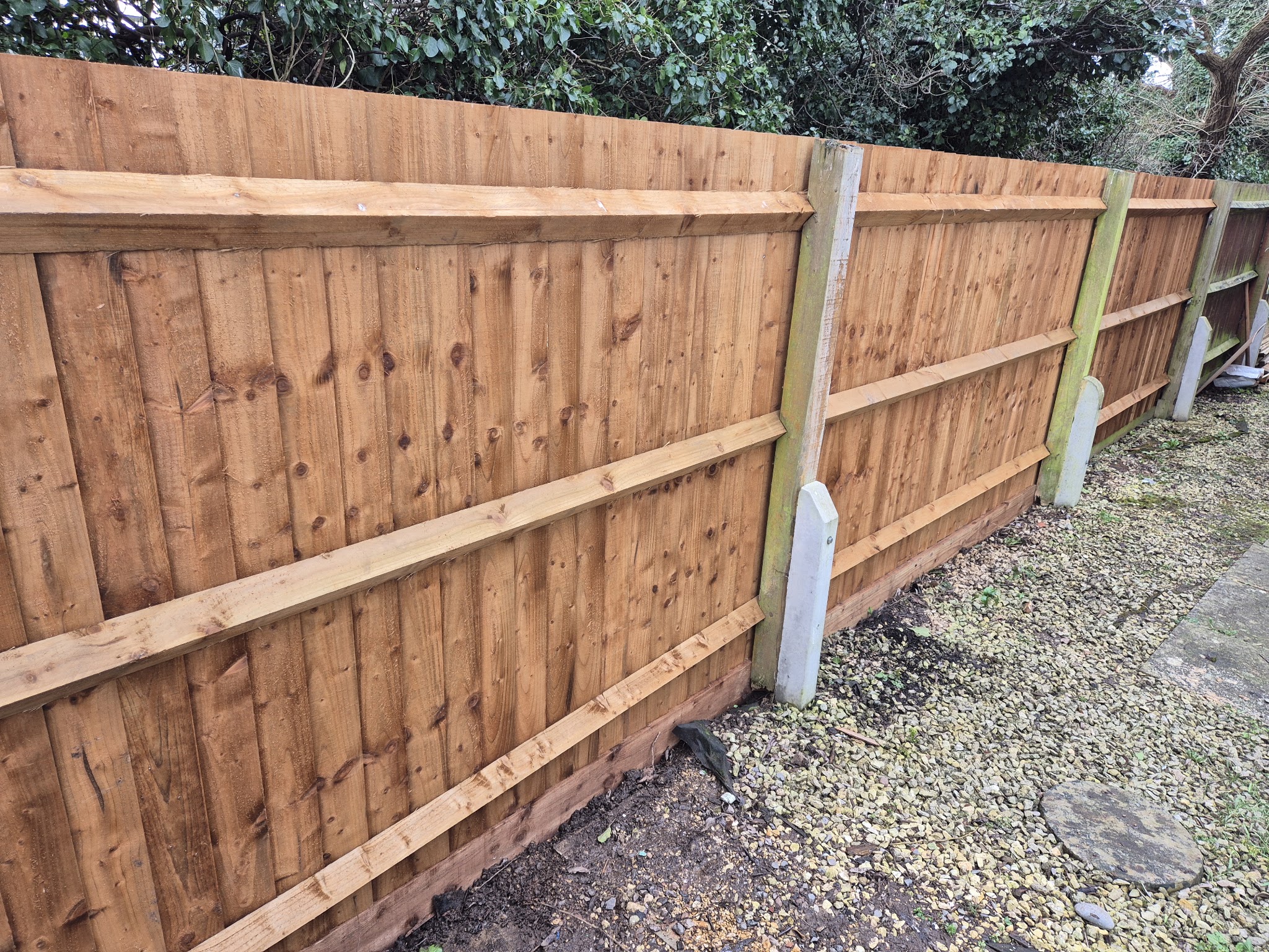 A new close-board fence with concrete posts