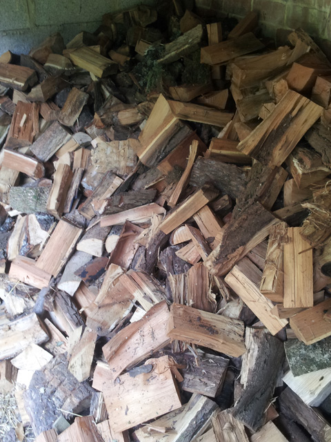A heap of freshly split hardwood logs